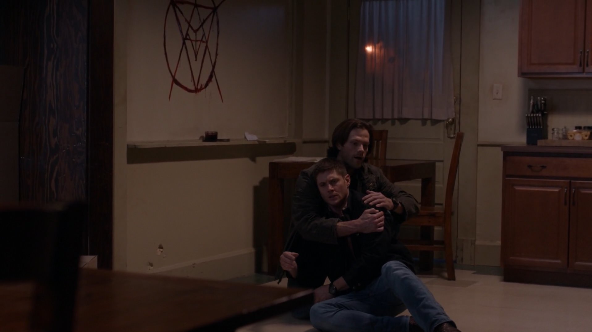 Sam cuddles Dean