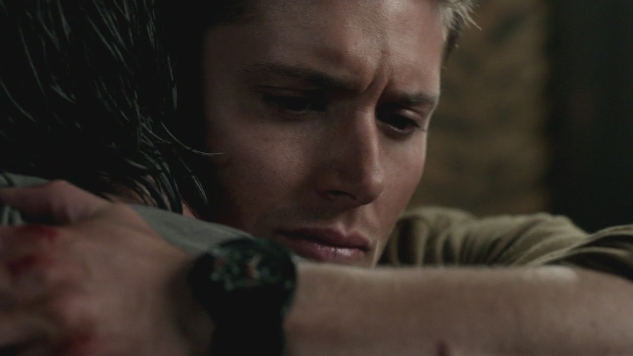 Close-up of Dean hugging Sam